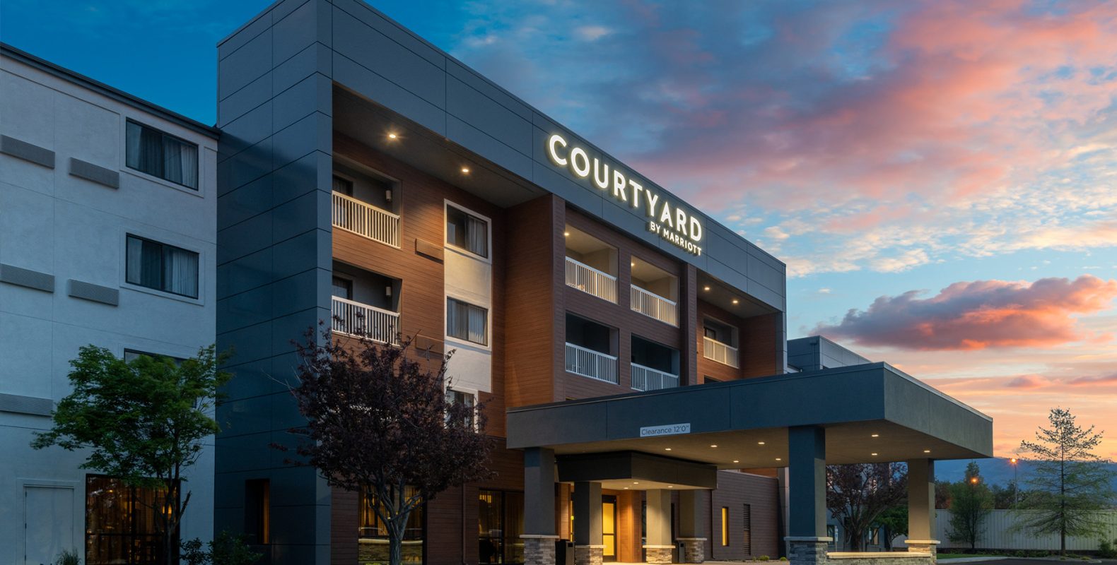 Courtyard by Marriott hotel renovation project by GEM Studio Architecture – hospitality exterior remodel at dusk, Colorado
